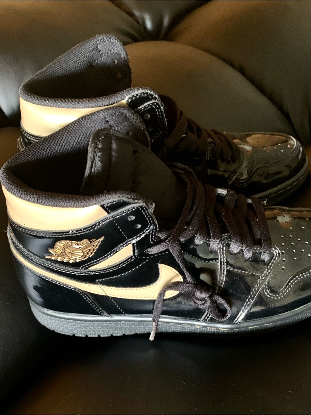 Nike Black and Cream High-Top Sneakers with Gold Wings Logo